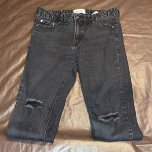 Black jeans with holes in the knee/low thigh